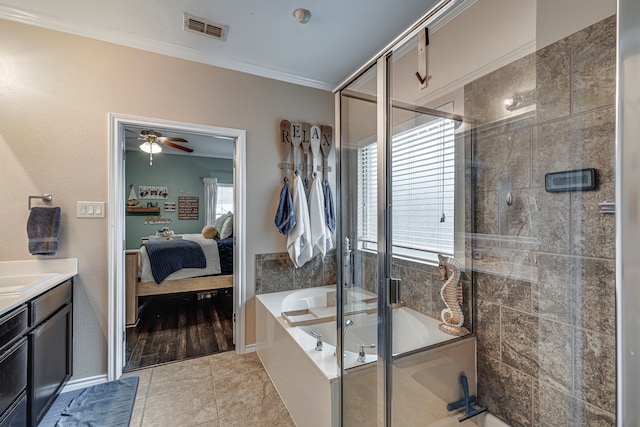 bathroom with tile patterned floors, ornamental molding, separate shower and tub, and vanity