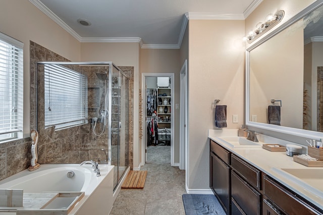 bathroom with shower with separate bathtub, tile patterned floors, crown molding, and vanity