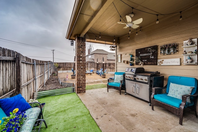 view of patio / terrace with area for grilling and ceiling fan