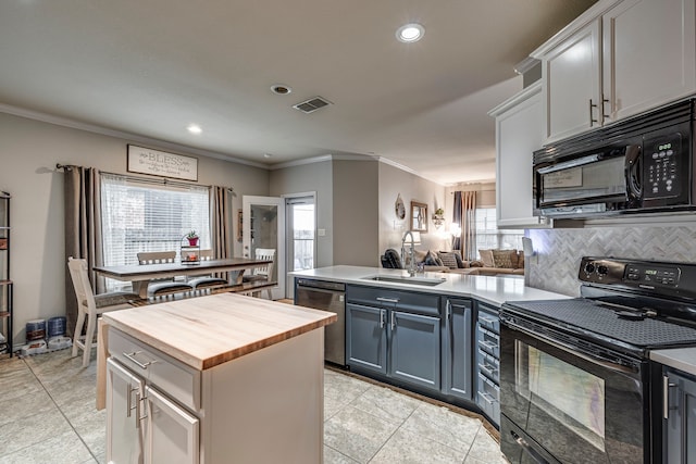 kitchen featuring gray cabinetry, black appliances, backsplash, sink, and kitchen peninsula