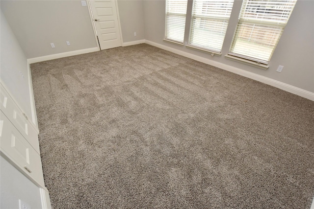 unfurnished room with carpet floors