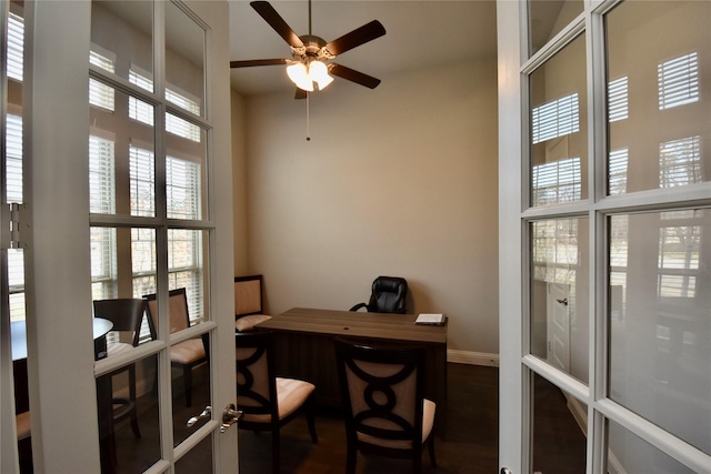 office space with dark wood-type flooring, french doors, and ceiling fan