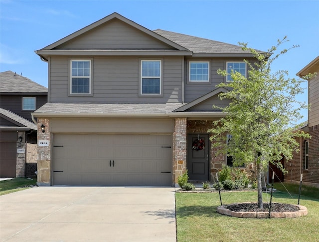 view of front of property with a garage and a front yard