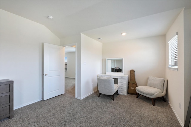 carpeted office featuring vaulted ceiling