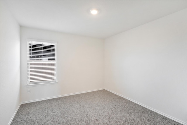 empty room featuring carpet flooring