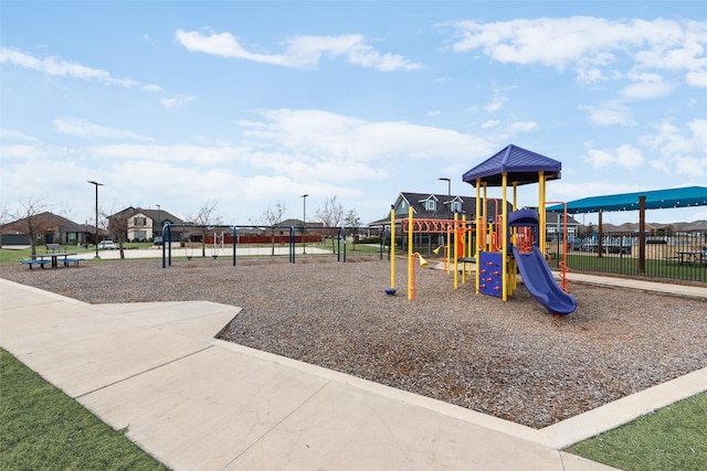 communal playground featuring fence