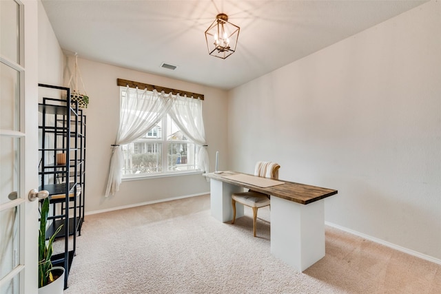 carpeted office space with baseboards, visible vents, and a notable chandelier