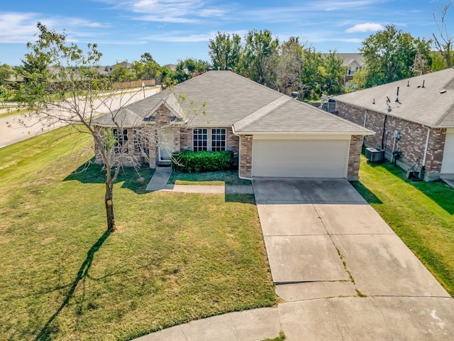 single story home featuring a garage and a front yard