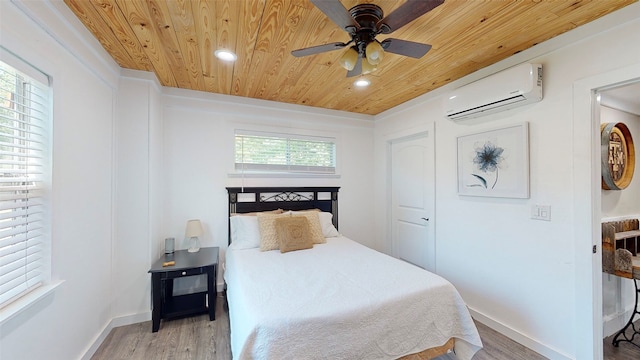 1004 Rs County Road 3345, Emory, TX 75440 - bedroom with ceiling fan, wooden ceiling, a wall mounted AC, and light wood-type flooring