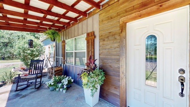 doorway to property featuring covered porch