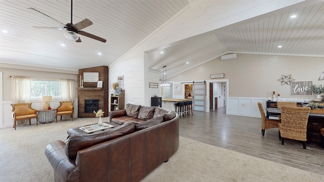 1004 Rs County Road 3345, Emory, TX 75440 - living room featuring vaulted ceiling, a barn door, a large fireplace, and wood ceiling