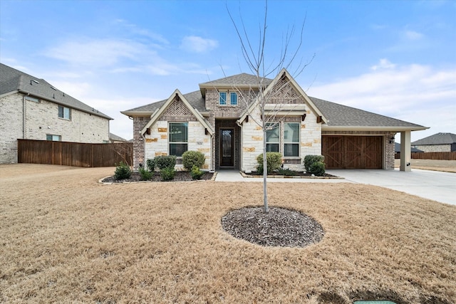 view of front facade featuring a garage and a front lawn