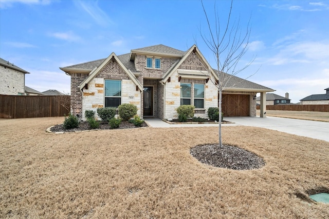 view of front of property featuring a garage and a front yard