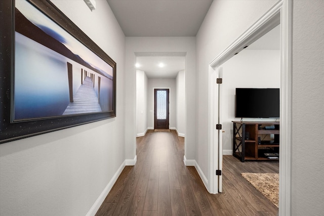 hallway featuring dark hardwood / wood-style floors