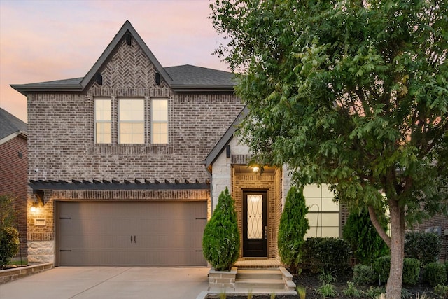 view of front of property featuring a garage