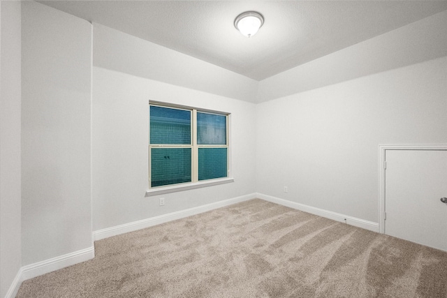 5204 Basham Ln, Mckinney, TX 75070 - spare room with carpet floors, lofted ceiling, and baseboards
