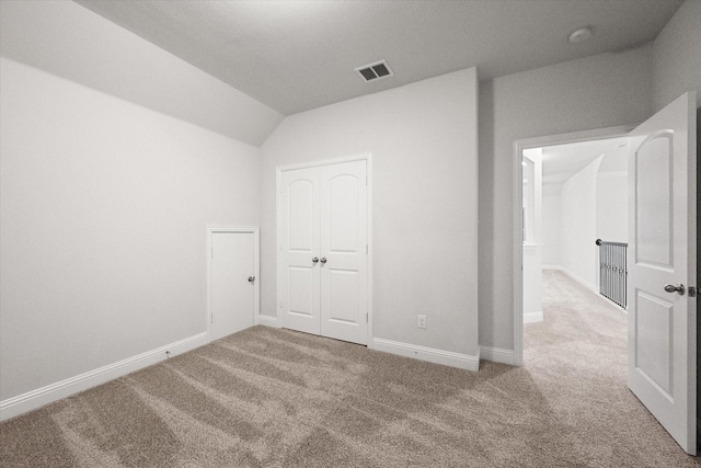 unfurnished bedroom with carpet flooring and a closet