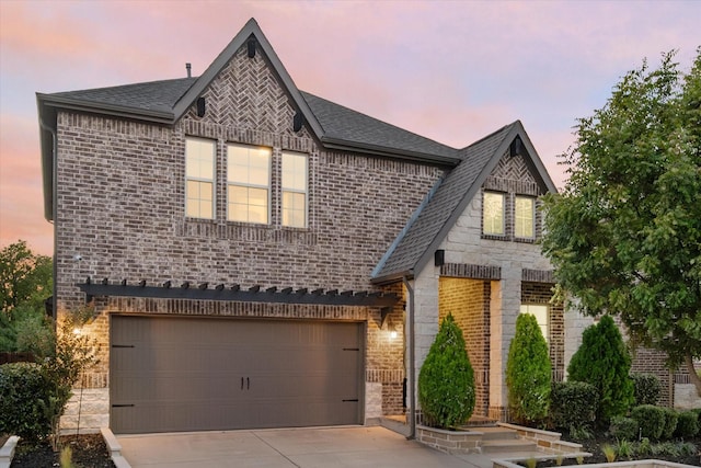 view of front of property with a garage