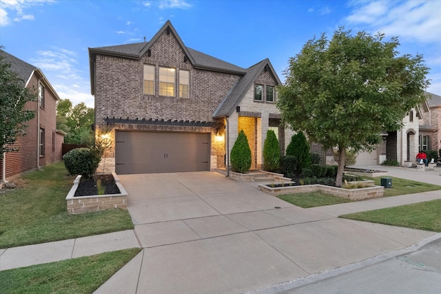 view of front of house featuring a garage and a front yard