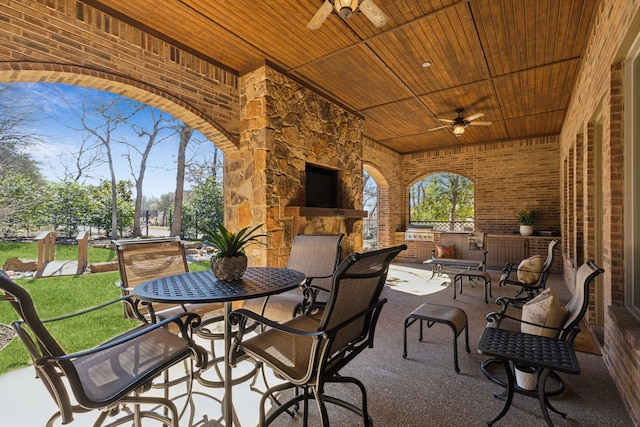 view of patio / terrace featuring a ceiling fan