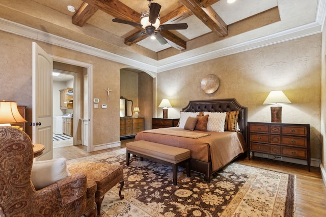 bedroom featuring beamed ceiling, coffered ceiling, wood finished floors, and crown molding