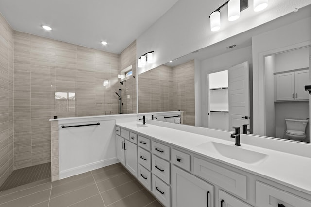 602 Lundy Ln, Mansfield, TX 76063 - full bathroom featuring double vanity, walk in shower, tile patterned floors, toilet, and recessed lighting