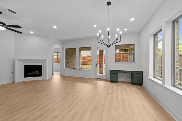 602 Lundy Ln, Mansfield, TX 76063 - unfurnished living room featuring light wood-style floors, recessed lighting, baseboards, plenty of natural light, and a ceiling fan