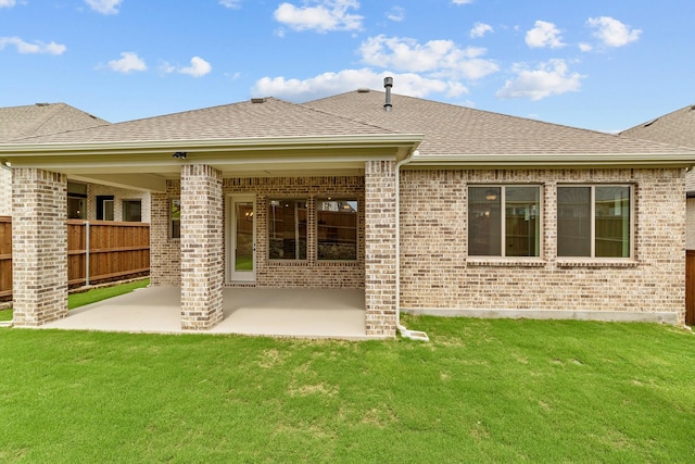 602 Lundy Ln, Mansfield, TX 76063 - back of house with brick siding, a shingled roof, and a patio