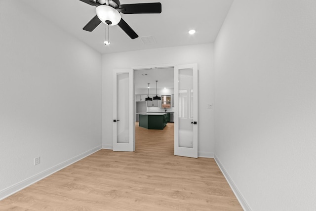 602 Lundy Ln, Mansfield, TX 76063 - spare room with french doors, light wood-style floors, baseboards, and ceiling fan