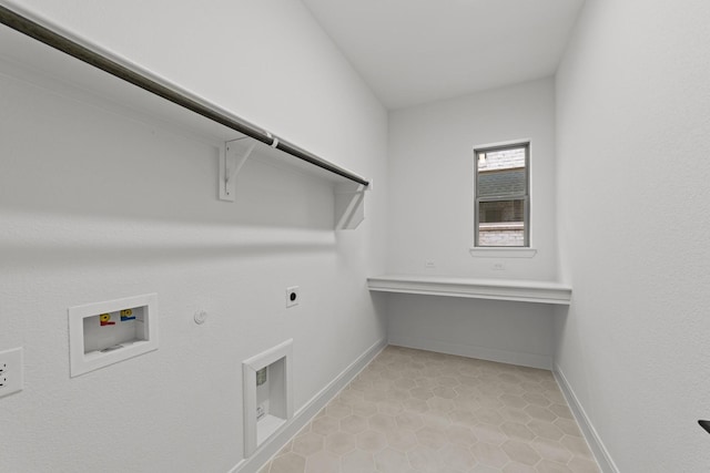 602 Lundy Ln, Mansfield, TX 76063 - laundry area with gas dryer hookup, electric dryer hookup, washer hookup, light tile patterned floors, and baseboards