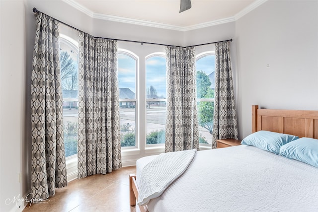 bedroom featuring ornamental molding and ceiling fan