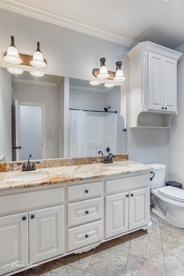 bathroom featuring ornamental molding, toilet, curtained shower, and vanity