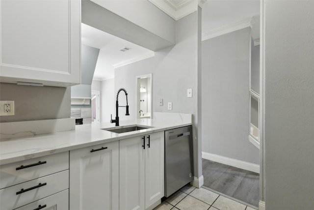 kitchen featuring white cabinetry, light stone countertops, sink, ornamental molding, and dishwasher