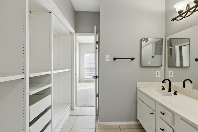 bathroom with tile patterned flooring and vanity