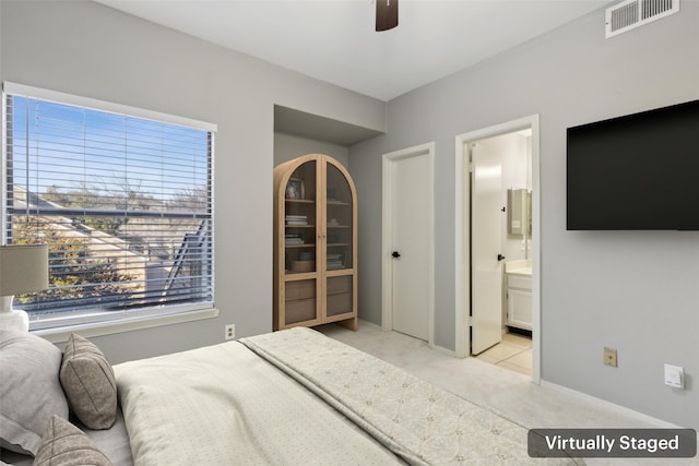 carpeted bedroom featuring ceiling fan and connected bathroom