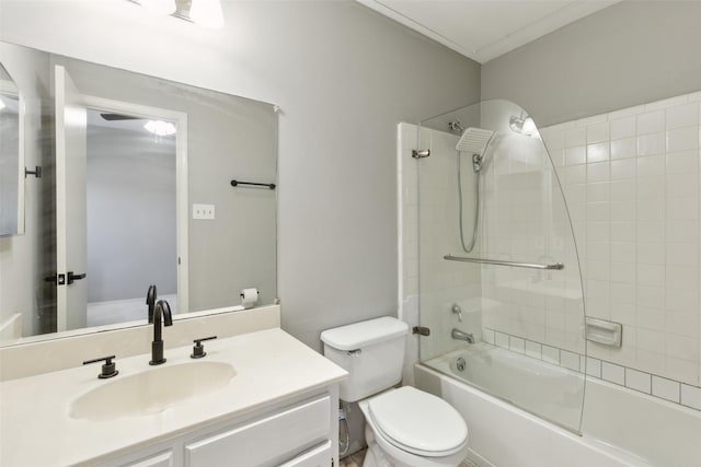 full bathroom with toilet, vanity, and tiled shower / bath combo