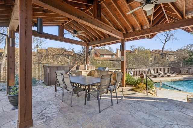 view of patio / terrace featuring a gazebo, ceiling fan, and a community pool