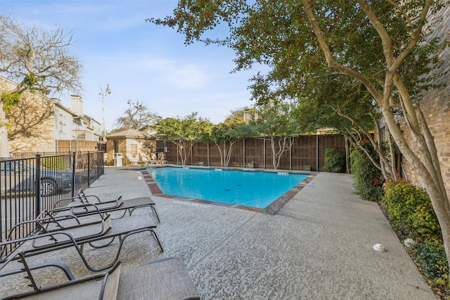 view of swimming pool with a patio area