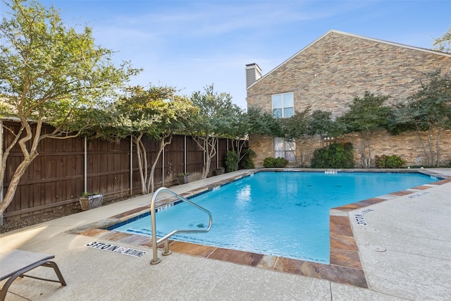 view of swimming pool featuring a patio