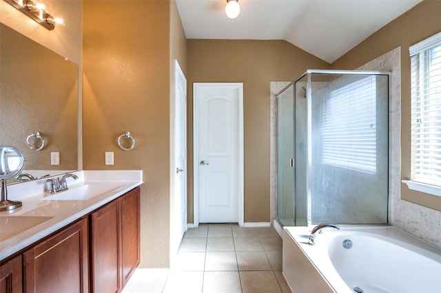 bathroom with tile patterned floors, plenty of natural light, separate shower and tub, and vaulted ceiling