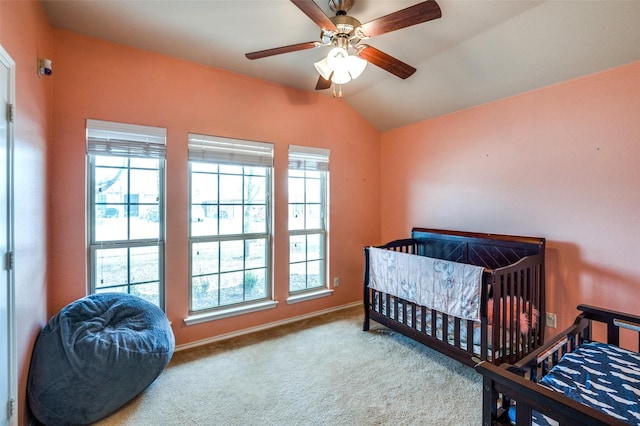 carpeted bedroom with lofted ceiling and ceiling fan