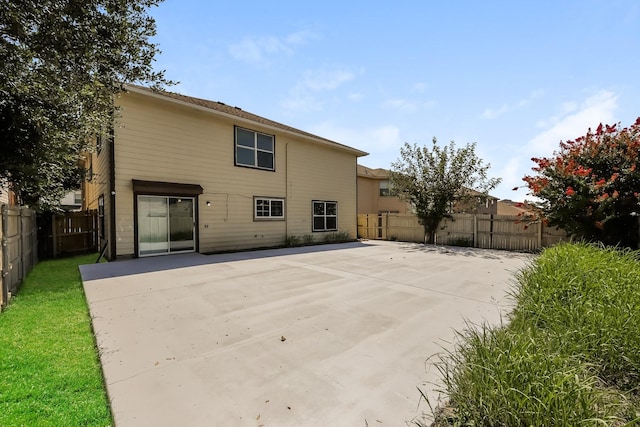 rear view of house with a patio