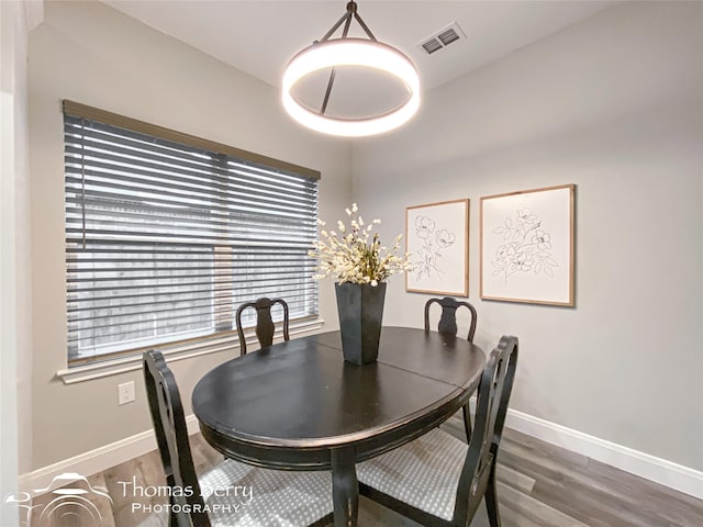 dining room featuring hardwood / wood-style flooring