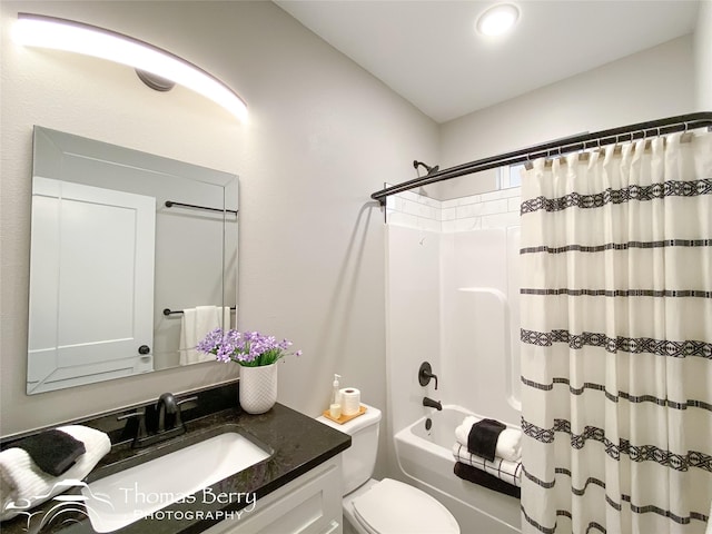 full bathroom with vanity, toilet, and shower / bath combo with shower curtain