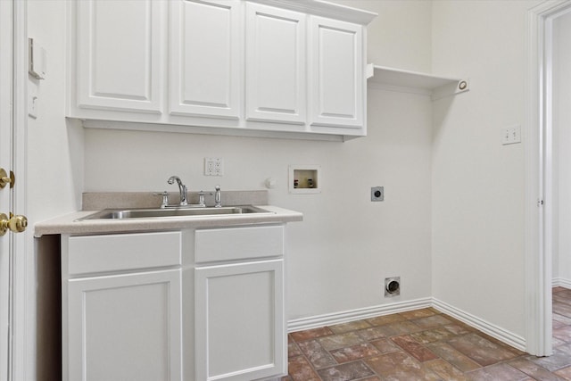 clothes washing area featuring cabinets, hookup for a washing machine, sink, and hookup for an electric dryer