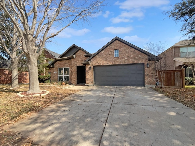 view of front of property with brick siding, concrete driveway, and an attached garage