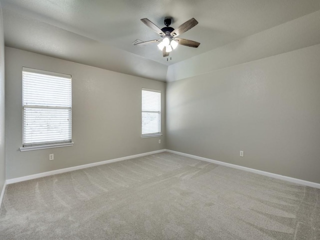 unfurnished room featuring light carpet and ceiling fan