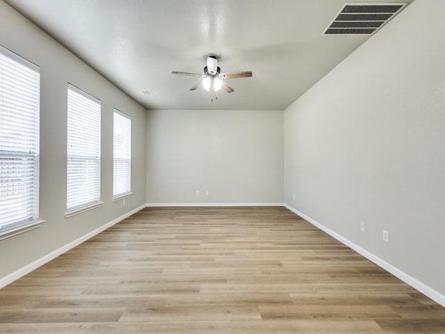 unfurnished room featuring light hardwood / wood-style floors and ceiling fan