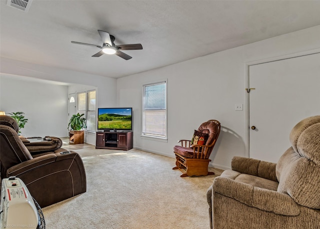 living room with light carpet and ceiling fan