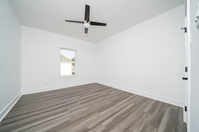 unfurnished room with hardwood / wood-style floors and ceiling fan